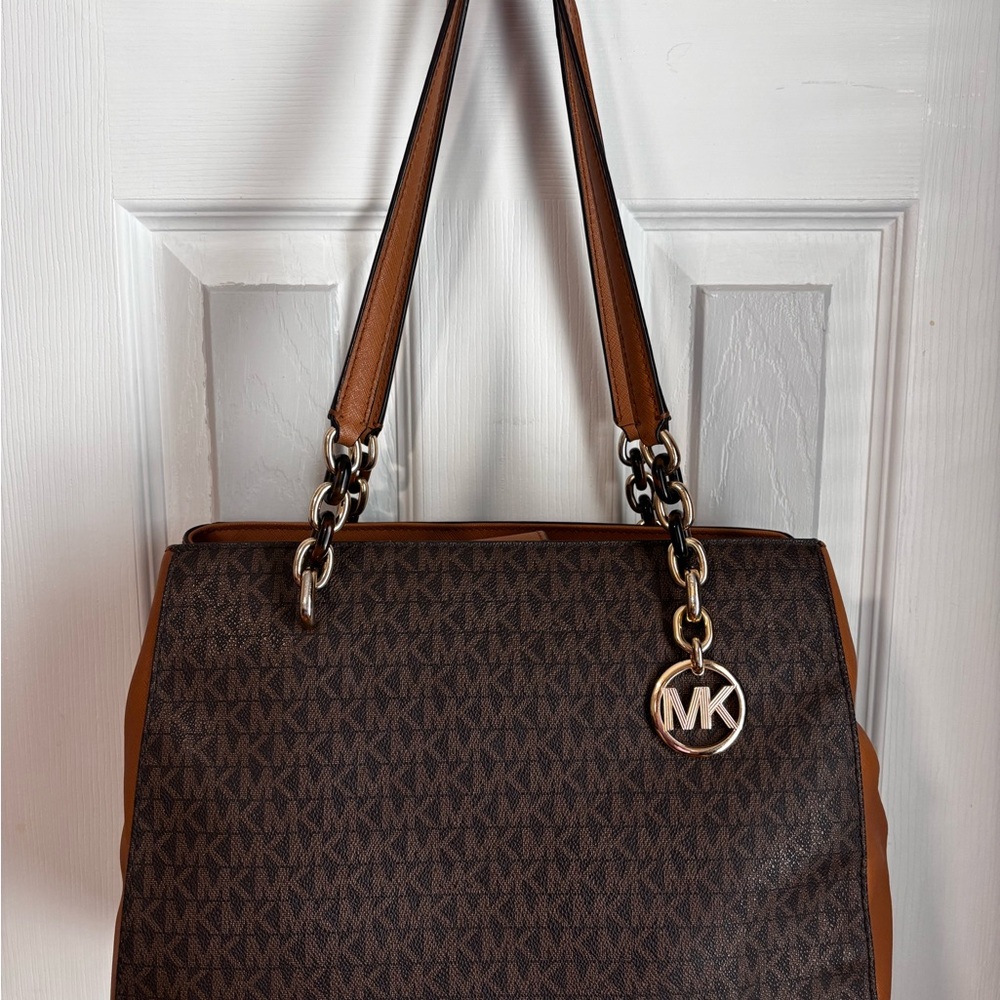 Michael Kors Brown Shoulder Bag with Monogram Pattern and Metal Accents